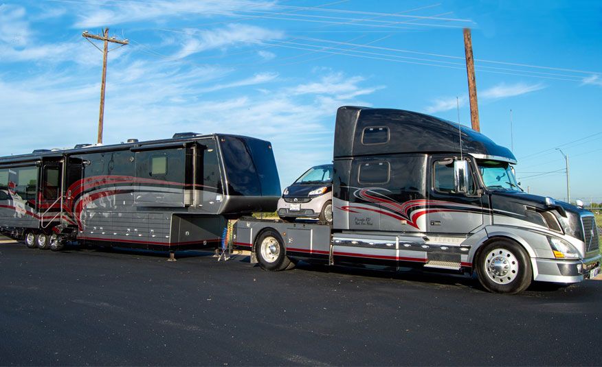 2015 Continental Coach with 2012 Smart Car and 2008 Volvo Truck to haul it all